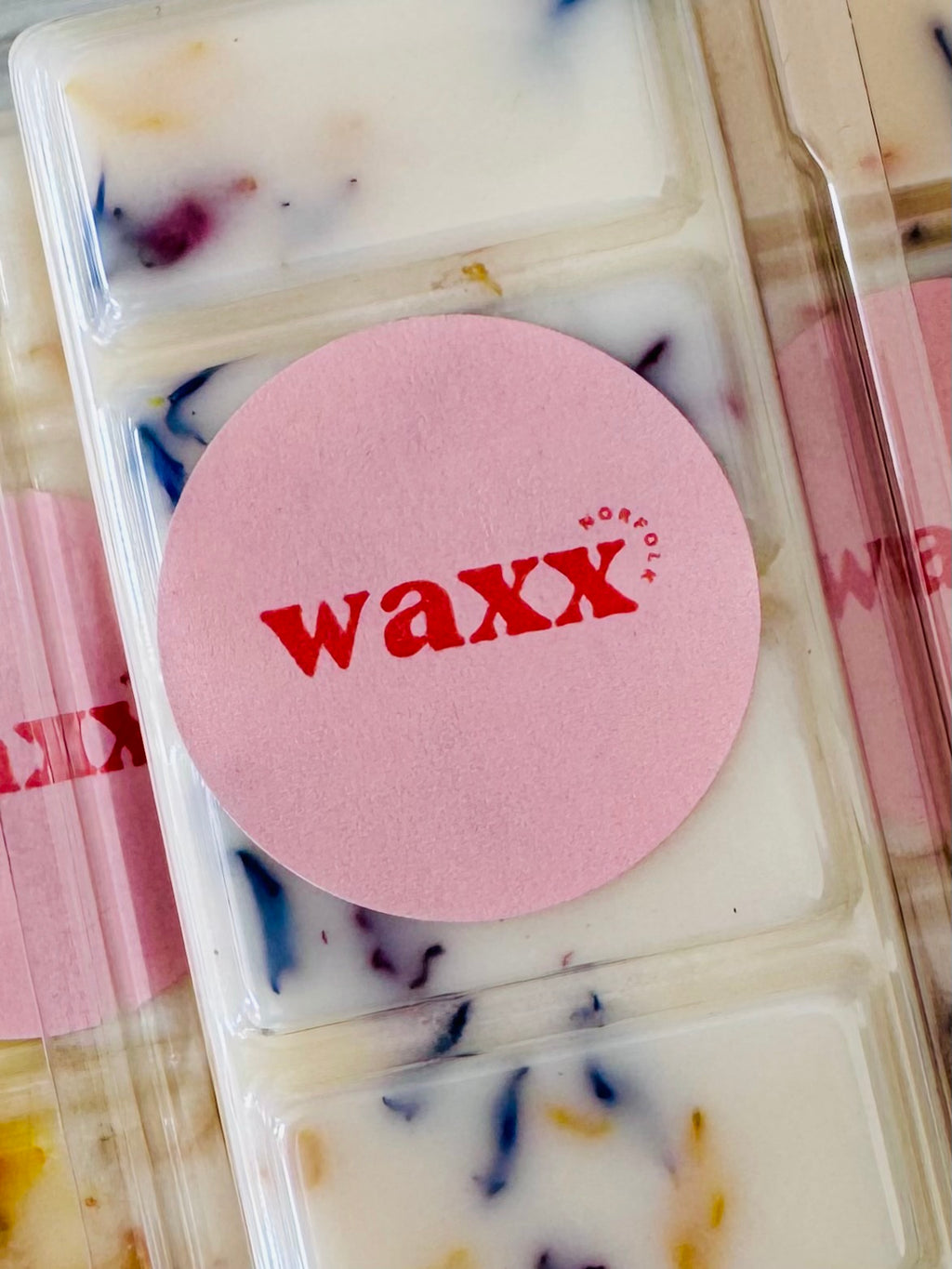 Waxx product with colorful wax blocks in a packaging tray.
